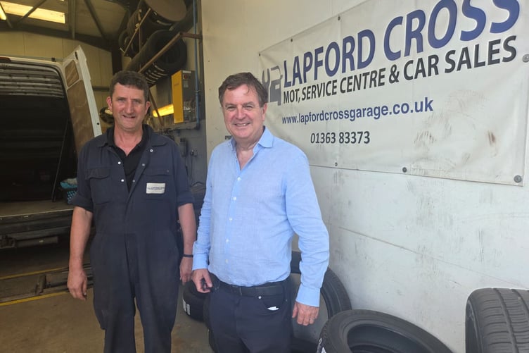Mike Squires of Lapford Cross MOT and Car Sales and Sir Mel Stride, the MP for Central Devon.